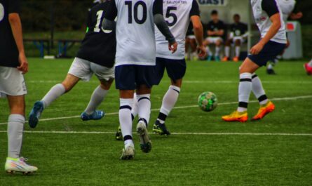 a group of men playing football